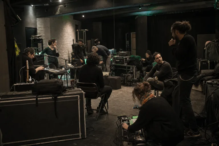 Artist collective and nonprofit crew preparing a cultural release in Paris