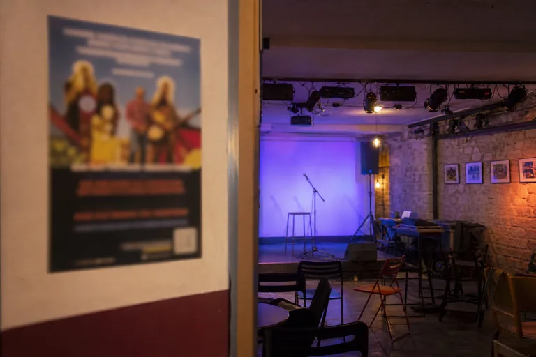 Poster and stage for Paris nonprofit cultural event