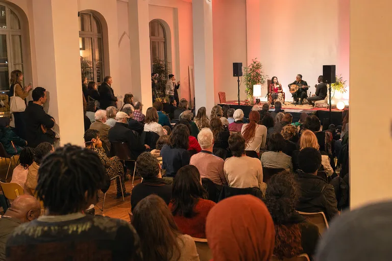 Audience experiencing performance at cultural event